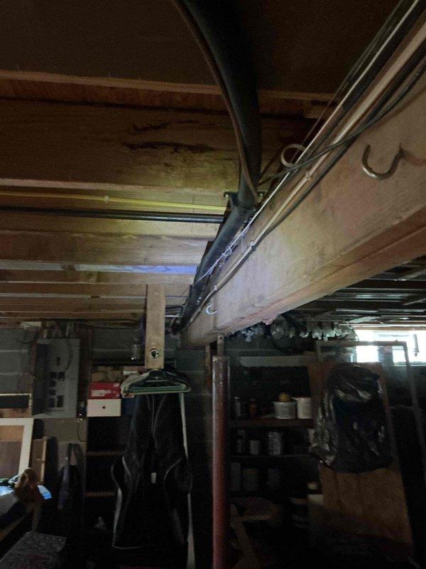 Completed electrical rewiring in basement utility area to accommodate new dishwasher installation. Ran new dedicated circuit with appropriate gauge wiring through exposed joist space, installed junction box, and verified all connections met code requirements for appliance load.