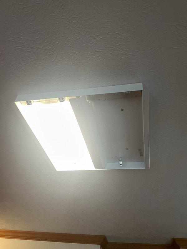 Replaced fluorescent light tubes in kitchen ceiling fixtures. Customer had replacement bulbs available but was unable to access the ceiling-mounted fixtures due to height limitations. Removed existing Philips F40T12/CW 40-watt fluorescent tubes from recessed ceiling fixtures and installed new tubes provided by customer. Verified proper operation of all fixtures upon completion.