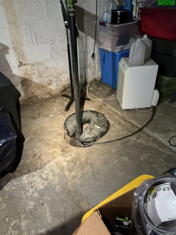 Provided complimentary assessment and quote for replacement of 25-year-old tanked water heater located in basement utility area. Upon inspection, evaluated existing Master Plumber brand water heater with connected copper piping, pressure relief valve system, and associated shut-off valves. Assessed current installation configuration including top-mounted plumbing connections with U-shaped copper pipe routing and red-handled isolation valve. Documented existing plumbing infrastructure, support pole positioning, and available workspace for potential replacement unit installation. Friends and family discount applied to quoted replacement services.