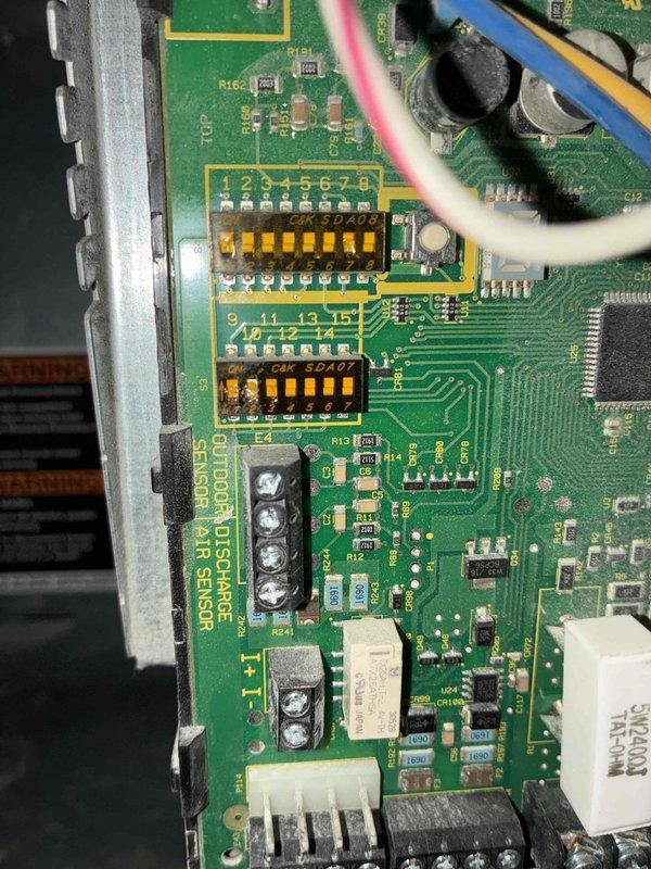 Completed scheduled MVP heating maintenance visit. Performed diagnostic testing on HVAC control system using digital multimeter, recording voltage readings at 5.94V on system wiring and control board connections. Inspected circuit board components including integrated circuits, relay assemblies, and air sensor terminal connections to verify proper operation and system functionality.