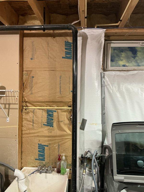Completed installation of new sump pump system in unfinished basement area. Installed pump unit with proper discharge piping, including vertical PVC discharge line secured to wall studs with mounting clips, and connected all necessary plumbing components to ensure effective water removal from the basement space.