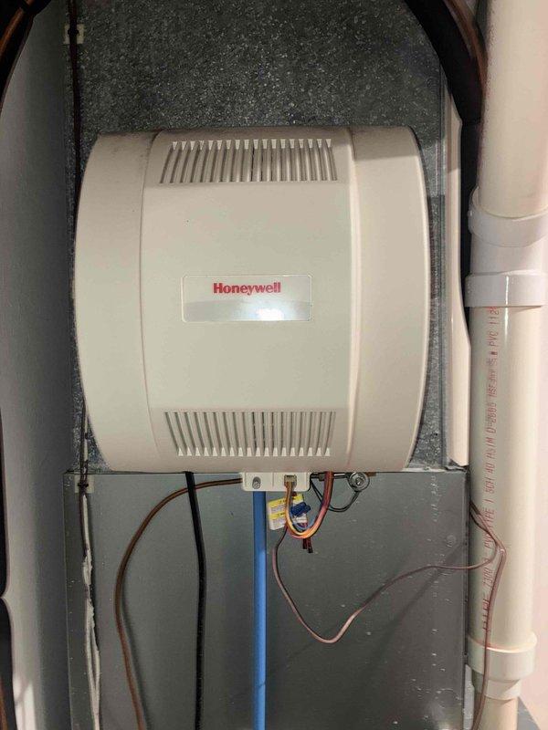 Completed recurring MVP heating maintenance visit on three furnace systems located in basement, outbuilding, and upstairs areas. Performed comprehensive inspections and maintenance procedures on all units, including a Rheem Classic 80 furnace system with associated ductwork and plenum assembly. Inspected and verified proper operation of Honeywell whole-house humidifier unit mounted on HVAC ductwork, confirming water supply line connections, electrical wiring, and solenoid valve functionality. Checked all PVC venting, reflective insulated ductwork, and flexible duct connections for proper sealing and installation. Verified furnace safety controls, burner operation, and airflow throughout all three heating systems. All units found to be operating within manufacturer specifications and ready for continued service.