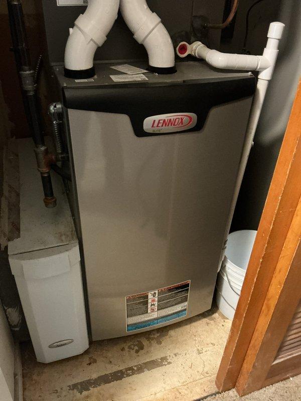 Completed routine MVP cooling maintenance visit on residential HVAC system. Performed comprehensive inspection of Lennox furnace unit in basement mechanical room and outdoor condensing unit with rooftop installation. Verified proper operation of all system components, checked electrical disconnect box and conduit connections, confirmed venting configuration on furnace intake and exhaust PVC piping, and documented equipment condition through photographic records. System found operating within normal parameters with no immediate service needs identified.