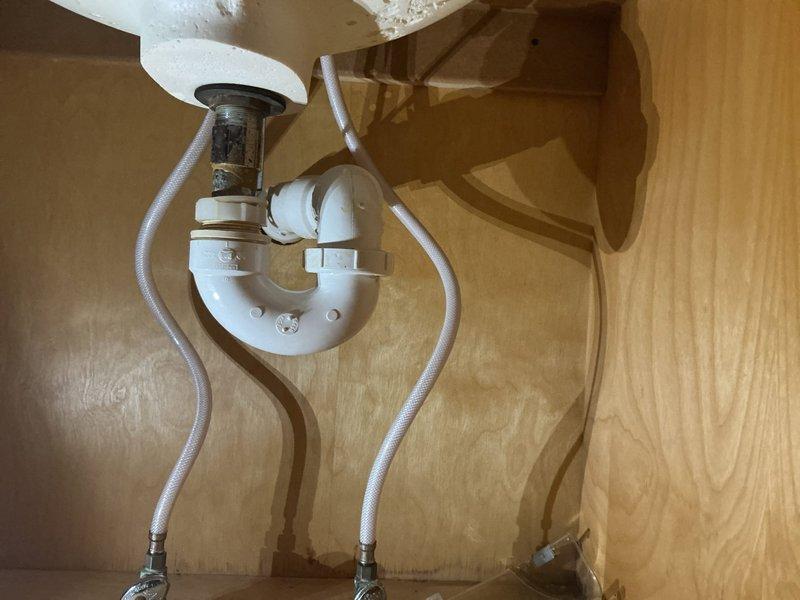 Performed pre-purchase plumbing inspection at residential property, focusing on tanked water heater and main gas line system. Conducted thorough visual examination of water heater installation, tested all connections, and performed comprehensive gas leak detection testing on main gas line and associated components to verify safe operation. Inspected bathroom plumbing fixtures including sink drain assembly with P-trap configuration and bathtub plumbing hardware, noting all fixtures functional with minor mineral deposits present on chrome components. All gas connections tested with no leaks detected, and water heater confirmed operational and properly vented.