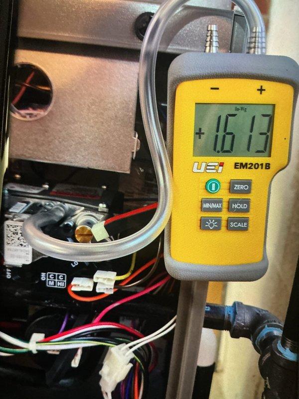 Completed routine heating maintenance on basement furnace unit as part of recurring MVP service program. Inspected and verified air filter condition, finding it clean with proper seal integrity. Measured system static pressure at 1613 pascals using digital manometer to confirm proper airflow and blower operation. All heating components operating within normal parameters with no service renewals required at this time.