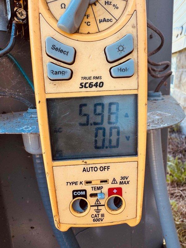 Completed comprehensive MVP air conditioning maintenance service. Performed electrical diagnostics using digital multimeter to verify system voltage and amperage readings, with measurements indicating proper electrical performance at 5.98 volts. Inspected internal control board assembly, including toroidal inductors, capacitors, and power components mounted to aluminum heatsink for adequate cooling. All circuit board components, wiring connections, and high voltage sections showed no signs of deterioration or damage. System operating within normal parameters.