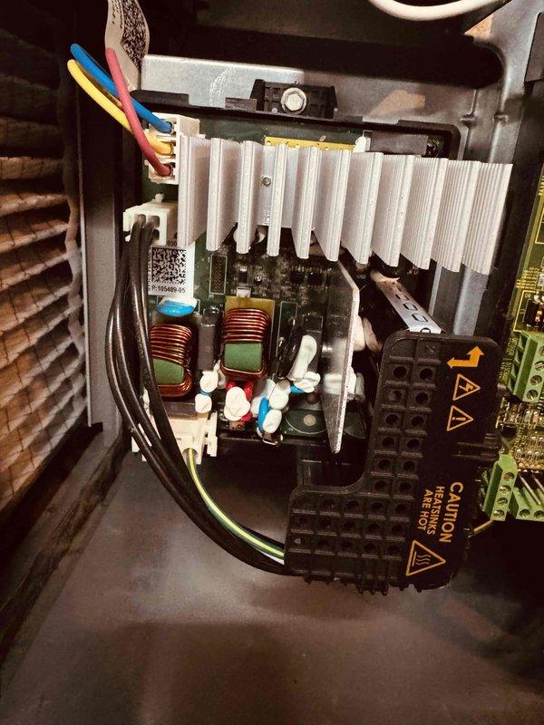 Completed comprehensive MVP air conditioning maintenance service. Performed electrical diagnostics using digital multimeter to verify system voltage and amperage readings, with measurements indicating proper electrical performance at 5.98 volts. Inspected internal control board assembly, including toroidal inductors, capacitors, and power components mounted to aluminum heatsink for adequate cooling. All circuit board components, wiring connections, and high voltage sections showed no signs of deterioration or damage. System operating within normal parameters.