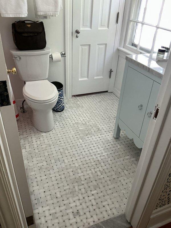 Responded to callback for ongoing sink issues following previous repair visit. Conducted thorough inspection of bathroom sink plumbing system and drain assembly. Examined P-trap configuration, supply line connections, and faucet mounting to identify source of continued problems. Photographed existing plumbing setup including corrugated P-trap, flexible supply lines, and drain components for documentation. Assessed overall condition of vanity cabinet plumbing and discussed repair options with customer to resolve persistent sink malfunction.