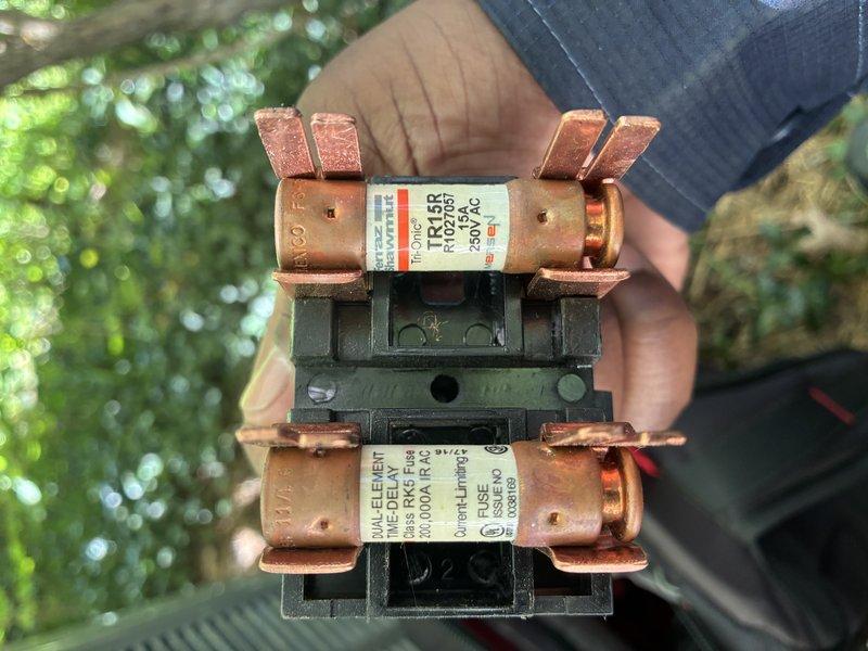 # HVAC Maintenance - Cooling Service

Completed comprehensive MVP AC maintenance on residential cooling system. Inspected and tested electrical components including time-delay fuses in outdoor disconnect, which showed signs of weathering and oxidation on copper surfaces but remained functional. Addressed heavily soiled blower motor assembly with significant dust and debris accumulation on motor housing, wiring connections, and surrounding components. Cleaned motor terminals and verified proper connections for red, purple, and additional conductor wires. Assessed MARS capacitor component covered in grime and dust buildup. Performed thorough system evaluation to ensure safe and efficient operation of cooling equipment.