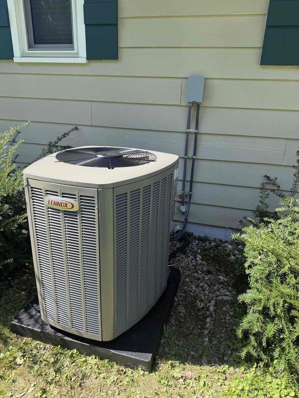 Completed installation of new 90% efficiency furnace system with associated flue venting. Installed Lennox condensing unit on exterior pad with proper refrigerant line routing and electrical disconnect, along with new ductwork and supporting infrastructure in exposed ceiling space. All components tested and operational upon completion.