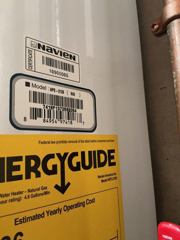 Performed routine maintenance flush on an 8-year-old Navien NFE-210S tankless water heater located in basement utility area. Descaled unit by circulating cleaning solution through the heat exchanger to remove mineral buildup and ensure optimal performance and efficiency. Verified all connections, inspected copper supply lines and isolation valves, and confirmed unit returned to proper operating condition upon completion.