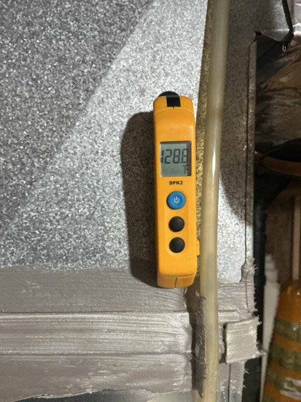 Completed comprehensive maintenance service on a 9-year-old Lennox gas furnace system. Performed thorough inspection of all major components including heat exchanger, burner assembly, and venting system. Verified proper operation of the furnace with digital temperature measurements showing supply air temperature of 128.8°F, indicating appropriate heat rise and combustion efficiency. Inspected PVC intake and exhaust venting for proper configuration and secure connections. Checked electrical connections, control wiring, and thermostat communication. Examined ductwork and transitions for proper airflow. Confirmed all safety controls and limit switches functioning correctly. System operating within manufacturer specifications with no issues identified.