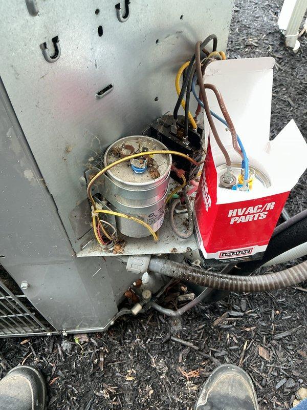 # HVAC Service - A/C

Responded to service call for 9-year-old air conditioning unit operating with abnormal noise. Upon inspection of outdoor condenser unit, identified failed capacitor as source of operational issue. Removed access panel and performed electrical component diagnostics. Replaced defective dual-run capacitor with new MARS replacement unit. Verified all electrical connections were secure and properly terminated. Cleaned accumulated debris from electrical compartment and components. Tested system operation following repair—unit now running quietly with normal sound levels and proper electrical readings. System returned to full operational status.