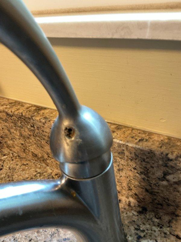 Responded to service call for loose kitchen faucet handle. Upon inspection, determined existing faucet required replacement due to worn internal components and mounting issues. Installed new brushed nickel finish kitchen faucet per customer request, ensuring proper connection to existing water supply lines. Verified hot and cold water lines, tightened all mounting hardware, and tested for leaks. Confirmed proper water flow and handle operation upon completion.