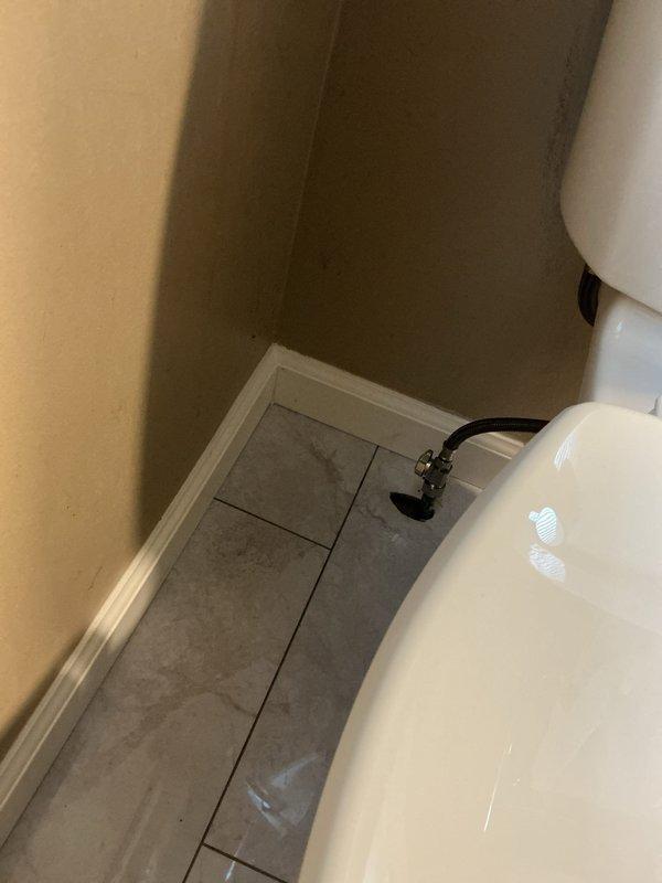 Removed and replaced an old Mansfield toilet that was leaking at the base with a new American Standard Cadet elongated bowl, right height model with slow-close seat. Replaced a corroded straight stop shut-off valve with a new chrome shut-off valve to ensure proper water supply control and prevent future leaks.