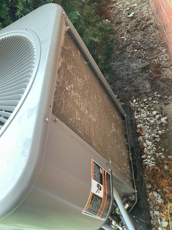 Completed MVP AC maintenance on outdoor condensing unit. Removed access panel to expose heavily clogged condenser coil with significant accumulation of dirt, dust, and debris causing restricted airflow. Cleaned condenser coil, removed buildup from exterior surfaces, and restored unit to proper operating condition. Unit tested and operating within normal parameters upon completion.