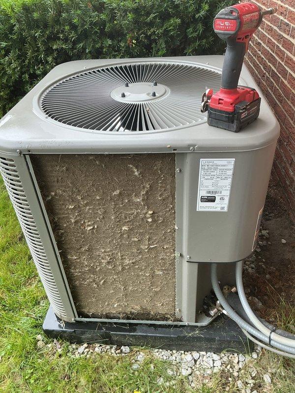 Completed MVP AC maintenance on outdoor condensing unit. Removed access panel to expose heavily clogged condenser coil with significant accumulation of dirt, dust, and debris causing restricted airflow. Cleaned condenser coil, removed buildup from exterior surfaces, and restored unit to proper operating condition. Unit tested and operating within normal parameters upon completion.