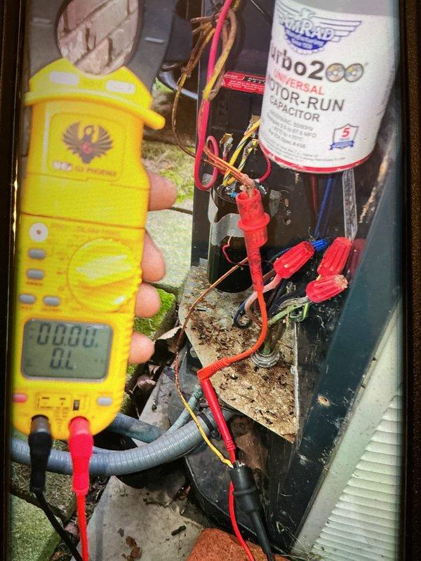 Completed MVP cooling maintenance visit on HVAC system. Performed electrical diagnostics using digital multimeter, testing capacitor functionality and electrical connections throughout the unit. Inspected Turbo200 dual run capacitor, wiring connections, and relay components; verified system operation and documented equipment condition with photos showing all electrical components functioning within normal parameters.