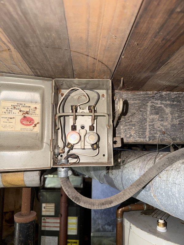 Responded to service call for non-functioning well pump pressure switch. Inspected electrical connections at attic-mounted safety disconnect and circuit protection serving well pump system. Verified wire integrity at junction box, checked fuse holders and internal connections for proper contact and signs of failure. Found loose wiring connection at pressure switch circuit that was preventing proper operation. Tightened all wire terminations, confirmed proper voltage supply to well pump controls, and tested pressure switch functionality to ensure restoration of normal operation.