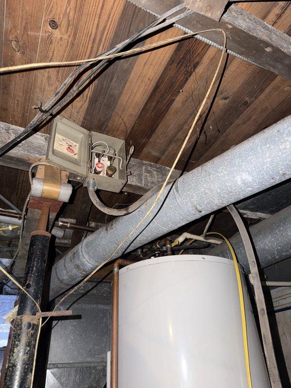 Responded to service call for non-functioning well pump pressure switch. Inspected electrical connections at attic-mounted safety disconnect and circuit protection serving well pump system. Verified wire integrity at junction box, checked fuse holders and internal connections for proper contact and signs of failure. Found loose wiring connection at pressure switch circuit that was preventing proper operation. Tightened all wire terminations, confirmed proper voltage supply to well pump controls, and tested pressure switch functionality to ensure restoration of normal operation.