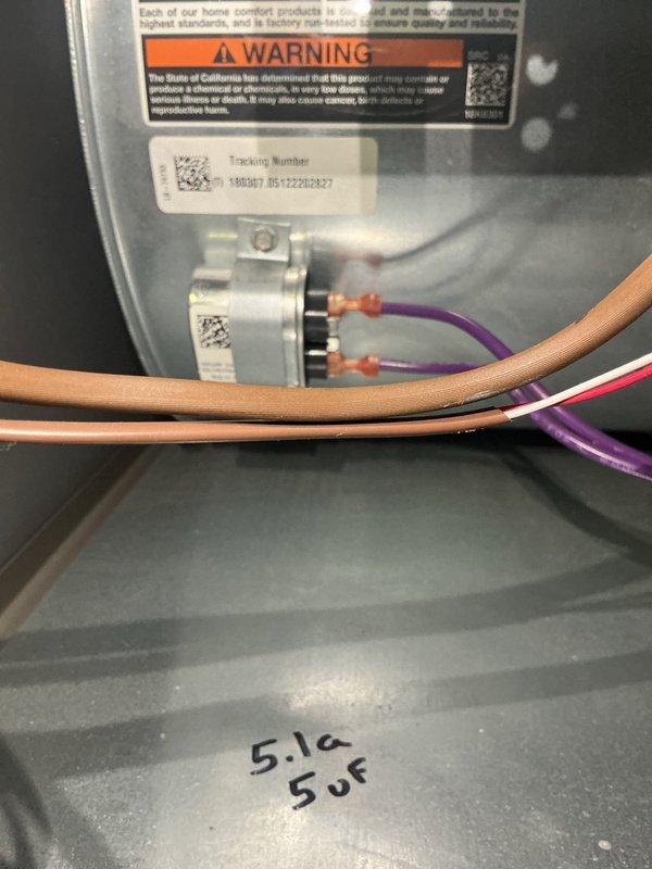 Completed MVP recurring maintenance visit on heating system. Performed comprehensive inspection of furnace unit, documenting blower motor assembly, electrical connections, and capacitor specifications (5.1a/5uF noted). All wiring connections secure with proper wire nuts, manufacturer labels and safety warnings verified intact and legible, unit operational and functioning within normal parameters.