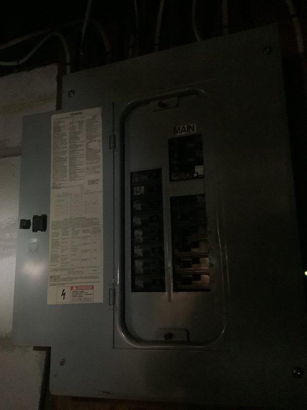 Conducted on-site assessment for whole house central air conditioning system replacement. Evaluated existing Carrier air handler unit in basement showing evidence of chronic condensate drainage issues with significant water staining on adjacent wall surfaces. Inspected electrical service panels and circuit capacity to determine compatibility with new system installation. Provided estimate for complete AC system replacement with recommended installation timeline for spring 2027 to optimize cost-effectiveness and availability.