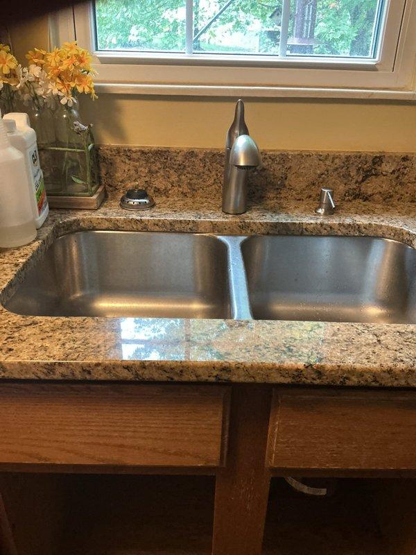 Completed installation of new kitchen faucet with brushed nickel finish and replaced both hot and cold water shutoff valves under the sink. The service required a second appointment to complete all work, with new compression fittings and flexible supply lines properly connected to ensure leak-free operation.