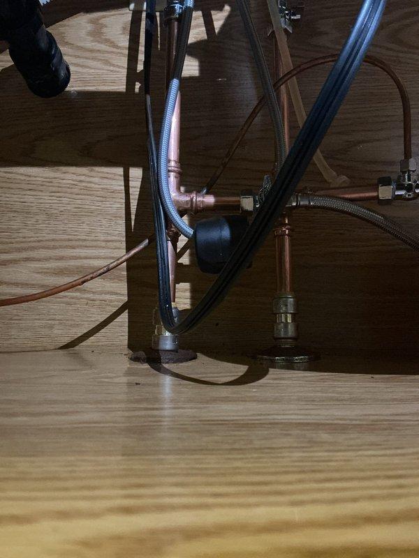 Completed installation of new kitchen faucet with brushed nickel finish and replaced both hot and cold water shutoff valves under the sink. The service required a second appointment to complete all work, with new compression fittings and flexible supply lines properly connected to ensure leak-free operation.
