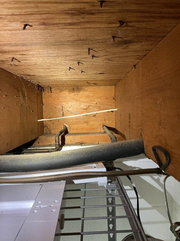 Responded to clogged basement toilet. Upon arrival, accessed the fixture and surrounding plumbing infrastructure in the basement utility area. Inspected exposed drain lines, vent piping, and structural plumbing configuration mounted to floor joists. Cleared blockage from toilet drain using appropriate augering equipment. Verified proper drainage and flush operation upon completion. Tested fixture multiple times to ensure full restoration of function with no backup or slow drainage issues remaining.