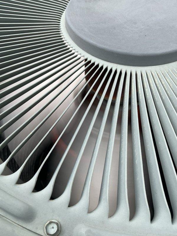Completed comprehensive AC tune-up on 15-year-old outdoor condensing unit. Performed standard maintenance protocol including inspection of condenser coils, fan assembly, and refrigerant lines; verified electrical connections at junction box and disconnect; cleaned condenser fins showing moderate dirt accumulation and weathering; checked refrigerant line insulation and PVC drainage connections. Unit operational and performing within normal parameters for age of equipment.