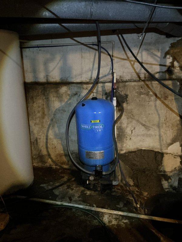 Responded to service call for well pump electrical issue. Inspected main electrical panel and verified proper circuit breaker operation for the water pump circuit. Examined well pressure tank (Well-Trol unit) and associated electrical connections in basement utility area. Confirmed all wiring connections secure and system operational. Payment collected in full at time of service. Customer advised this was a second service call for follow-up.