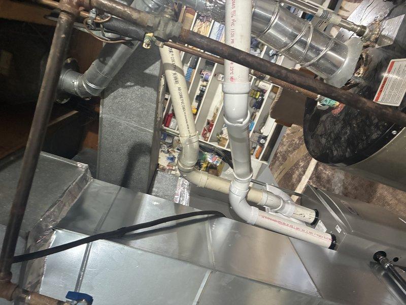 Responded to callback for rattling furnace noise. Upon inspection, identified improperly installed PVC exhaust venting that was not glued at connections and installed at incorrect angle. Returned with appropriate PVC fittings and reran entire exhaust vent line to manufacturer specifications, ensuring proper pitch and secure glued connections throughout. Verified system operation with no abnormal noise upon completion.