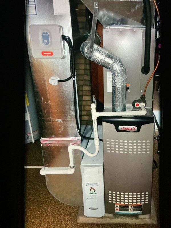 Completed scheduled MVP heating maintenance visit on a 5-year-old Lennox furnace system. Performed comprehensive inspection of all heating components, including thorough examination of the flame sensor, which was removed and inspected for proper operation. Verified all electrical connections, wire bundles, and terminals for secure attachment and proper insulation. Inspected furnace cabinet, heat exchanger, and ventilation components for signs of wear, corrosion, or deterioration. Checked aluminum flex duct connection and confirmed proper airflow configuration. Examined condensate drainage system including PVC piping for clogs or leaks. All system components found to be in good operational condition with no immediate repairs required. Unit tested and operating within normal parameters.
