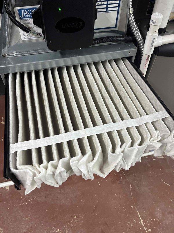 Completed maintenance visit on 3-year-old Carrier furnace system. Inspected and serviced unit, including filter examination which showed normal dust accumulation consistent with regular operation. Filter displayed typical pleated media construction with expected service wear. Verified system components and accessibility, ensuring proper operational readiness for continued heating season performance.