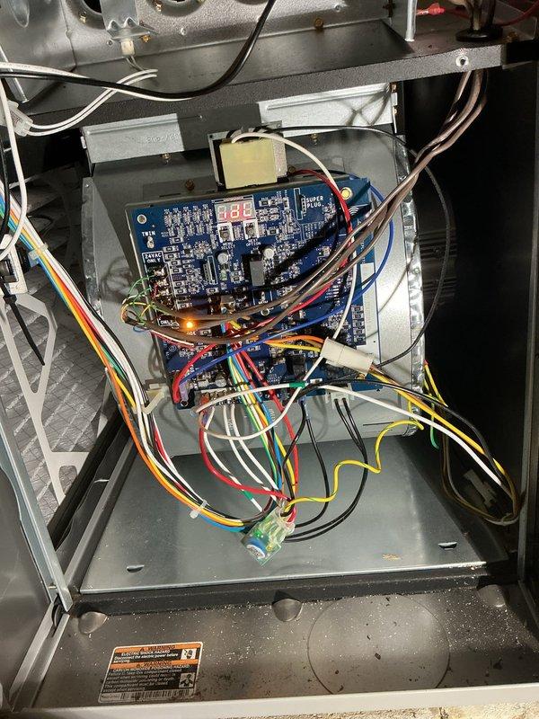 Completed comprehensive cooling maintenance on a 2-year-old outdoor air conditioning system. Performed thorough inspection of electrical components including capacitors, control board displaying proper operational codes, and all associated wiring connections. All components found to be functioning within normal parameters, with system operating efficiently and ready for continued service.