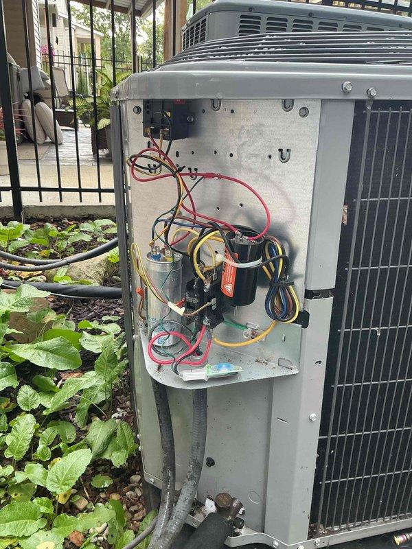 Completed comprehensive cooling maintenance on a 2-year-old outdoor air conditioning system. Performed thorough inspection of electrical components including capacitors, control board displaying proper operational codes, and all associated wiring connections. All components found to be functioning within normal parameters, with system operating efficiently and ready for continued service.