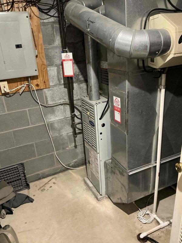 Conducted estimate and provided quote for complete furnace replacement in residential basement mechanical room. Assessed existing gray metal furnace unit with connected ductwork, electrical panel connections, and gas line configuration, documenting current system layout and specifications. Customer expressed interest in 24-month 0% financing option for replacement installation.