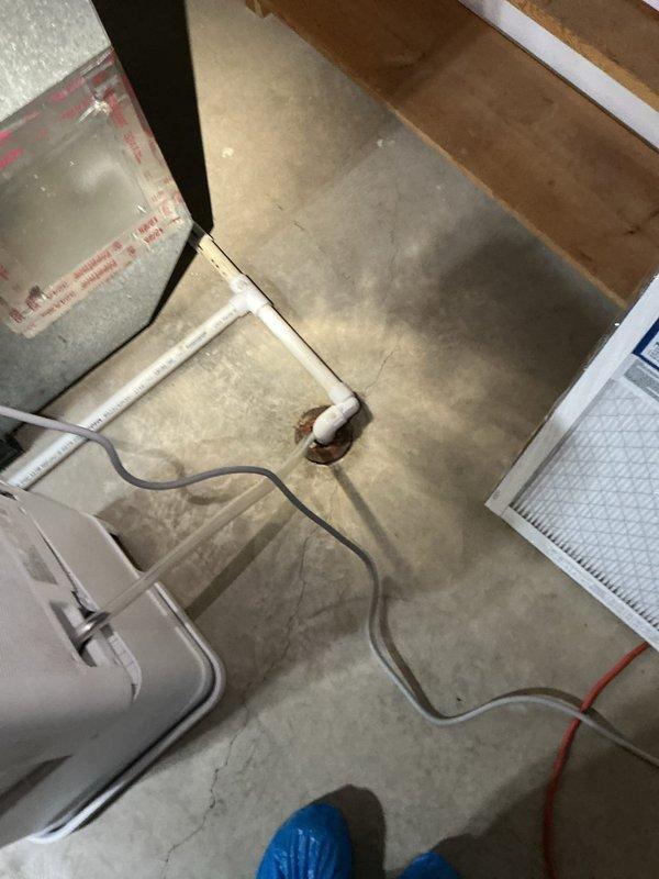 Responded to service call for natural gas water heater replacement quote. Upon arrival, inspected existing water heater unit located in basement utility area. Documented current equipment, which was manufactured in April 2017 and showed standard safety labeling including fire and explosion hazard warnings for flammable vapor ignition. Photographed installation area including concrete floor conditions, exposed floor joists, existing plumbing connections, and floor drain access point. Assessed utility connections including gas line, water supply lines, and venting requirements for replacement specifications. Provided detailed quote for complete water heater replacement with proper code-compliant installation.