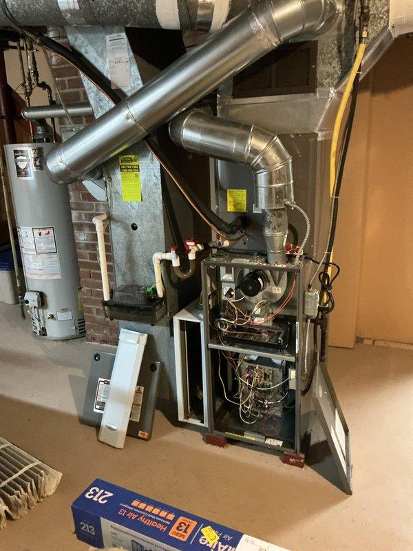 Completed comprehensive heating maintenance on 14-year-old gas furnace system located in basement utility area. Performed thorough inspection of furnace cabinet, internal components, electrical connections, and control boards. Evaluated ductwork connections, condensate management system, and verified proper air filtration. All mechanical components, safety controls, and operational systems inspected and found functioning within manufacturer specifications for unit of this age.