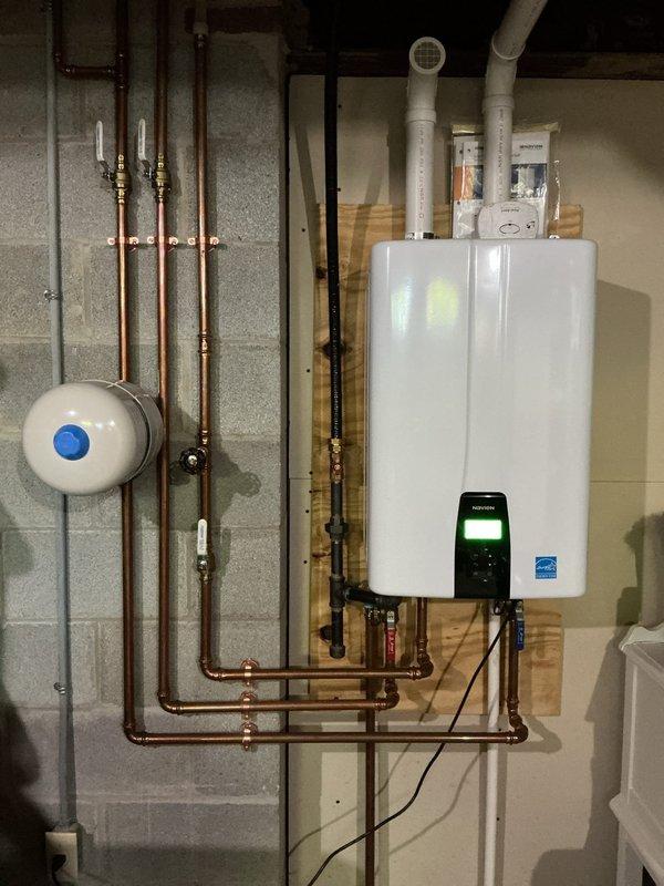 Performed scheduled maintenance on tankless water heater system, including complete flush procedure to remove mineral buildup and sediment accumulation. Accessed unit through ceiling opening, isolated system using shut-off valves, and flushed heat exchanger with descaling solution to restore optimal performance and efficiency. Verified proper operation of all components, confirmed adequate water flow, and ensured system returned to normal operating parameters upon completion.