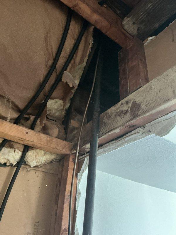 Relocated existing gas line that was previously routed from above by cutting and rerouting the line to run down the wall for improved aesthetics and functionality. Extended the gas line to accommodate future oven installation and properly capped the termination point to ensure safe, code-compliant closure until the appliance is connected. Work performed in interior wall cavity with exposed framing, requiring coordination around existing insulation and electrical infrastructure.