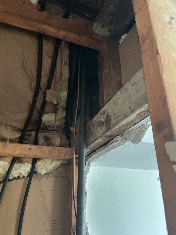 Relocated existing gas line that was previously routed from above by cutting and rerouting the line to run down the wall for improved aesthetics and functionality. Extended the gas line to accommodate future oven installation and properly capped the termination point to ensure safe, code-compliant closure until the appliance is connected. Work performed in interior wall cavity with exposed framing, requiring coordination around existing insulation and electrical infrastructure.