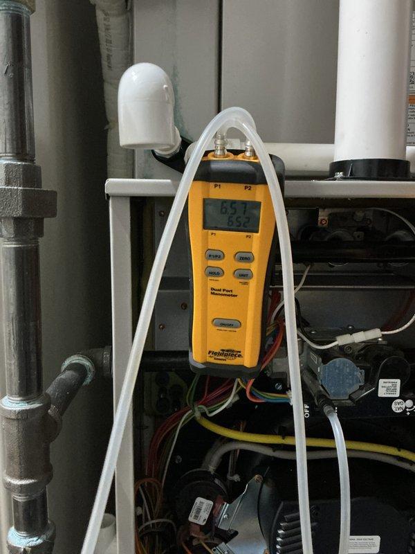 Completed maintenance value plan heating inspection on two furnace systems. Performed comprehensive system diagnostics using digital manifold gauges to verify proper refrigerant pressures and operational parameters. Inspected all refrigerant line connections, mounting hardware, and interior cabinet components for both units, confirming secure copper line installations and proper fastening. All systems operating within normal specifications with no deficiencies noted.