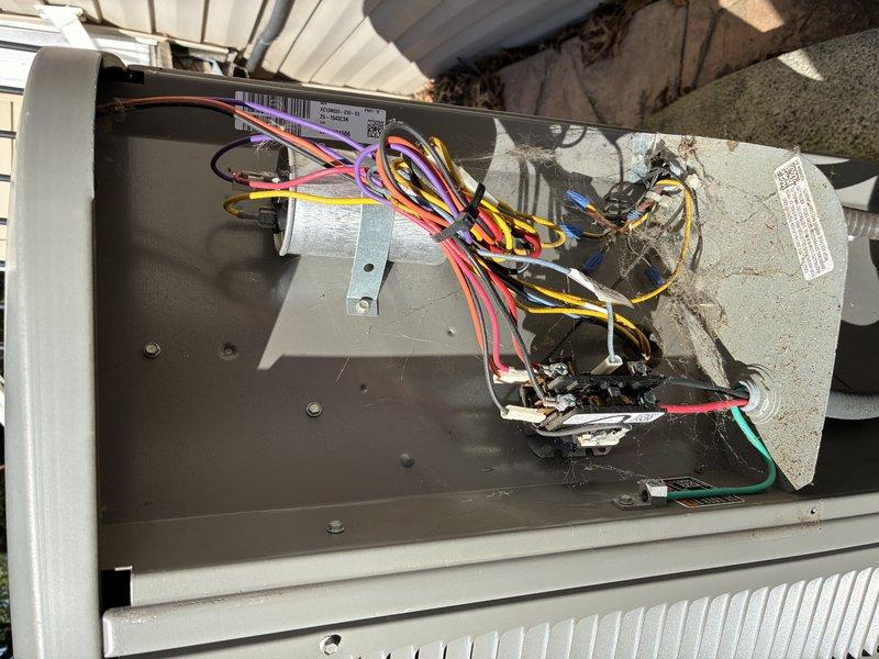 Completed routine HVAC maintenance visit for MVP customer's Lennox condensing unit. Performed system inspection, accessed electrical components and wiring connections, documented unit condition with exterior and interior photographs showing proper installation on concrete pad with all safety controls and capacitor in place.