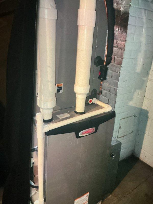 Completed scheduled MVP heating maintenance on a 1-year-old Lennox gas furnace system. Performed comprehensive inspection of all components including heat exchanger, burner assembly, ignition system, blower motor, and venting system with dual PVC intake/exhaust pipes. All equipment operating within normal parameters with no issues identified.