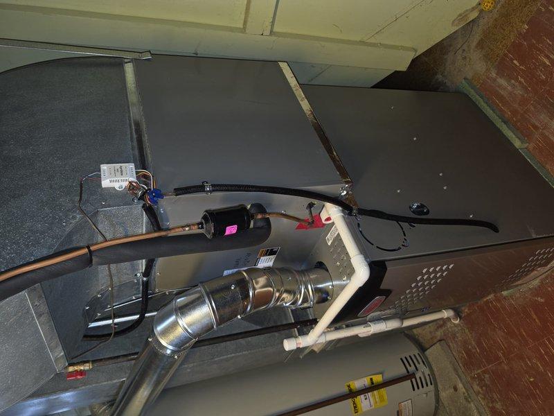 Installed 80% efficiency furnace unit in attic space, completing first-stage equipment installation with reused existing ductwork connections. Unit positioned on protective platform with proper clearances, electrical connections completed, and all components verified operational prior to departure.