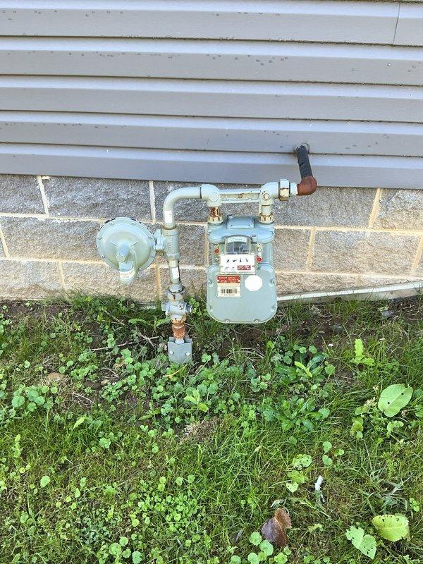 Installed natural gas line from existing meter to backyard patio area for new outdoor fireplace connection. Trenched across lawn approximately 120 feet, laid appropriate gas-rated pipe with proper depth and bedding, marked utility line locations prior to excavation, and pressure tested system to ensure leak-free operation. All work completed to code specifications with shutoff valve installed at appliance location.