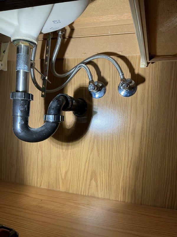 Replaced 35-year-old Delta shower valve in master bathroom by opening drywall behind fixture, installing two ball valves for isolation, and installing new Moen Chateau shower faucet in chrome finish. Installed access panel to cover drywall opening for future maintenance access. Replaced lavatory faucet in hall bathroom with new Moen Chateau faucet in chrome finish, including installation of new angle stops for proper water supply isolation. All fixtures tested and verified operational upon completion.