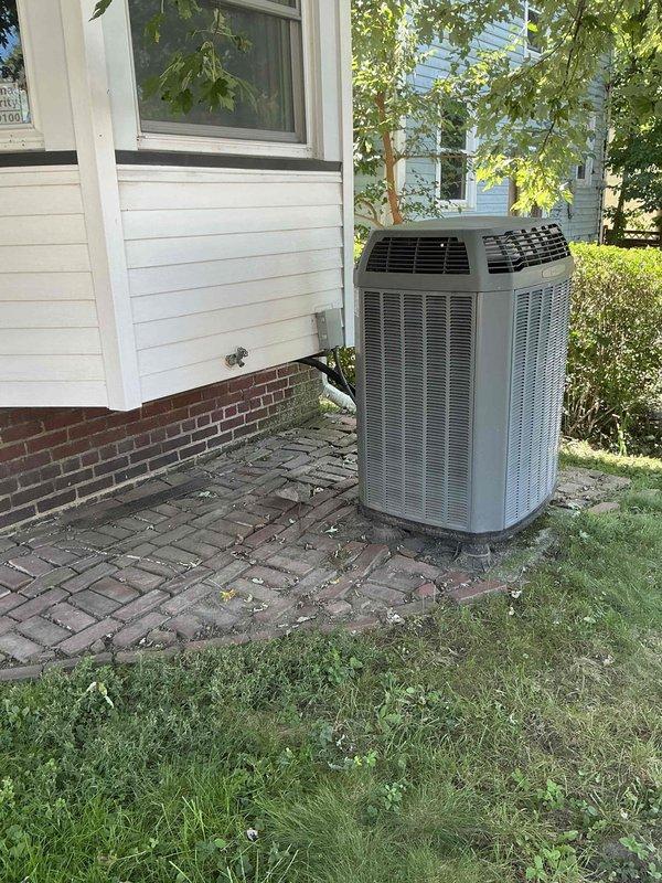 Responded to service call for air conditioning system with reported refrigerant leak. Performed comprehensive diagnostic evaluation of existing Trane furnace and dual outdoor condenser units installed on brick paver pad adjacent to residence. Assessment revealed active refrigerant leak in AC system requiring repair, humidifier component needing replacement, and potential furnace issues warranting further evaluation. Provided detailed estimate for complete HVAC system replacement including new furnace, air conditioning equipment, and associated components to address multiple system deficiencies and ensure reliable climate control operation.