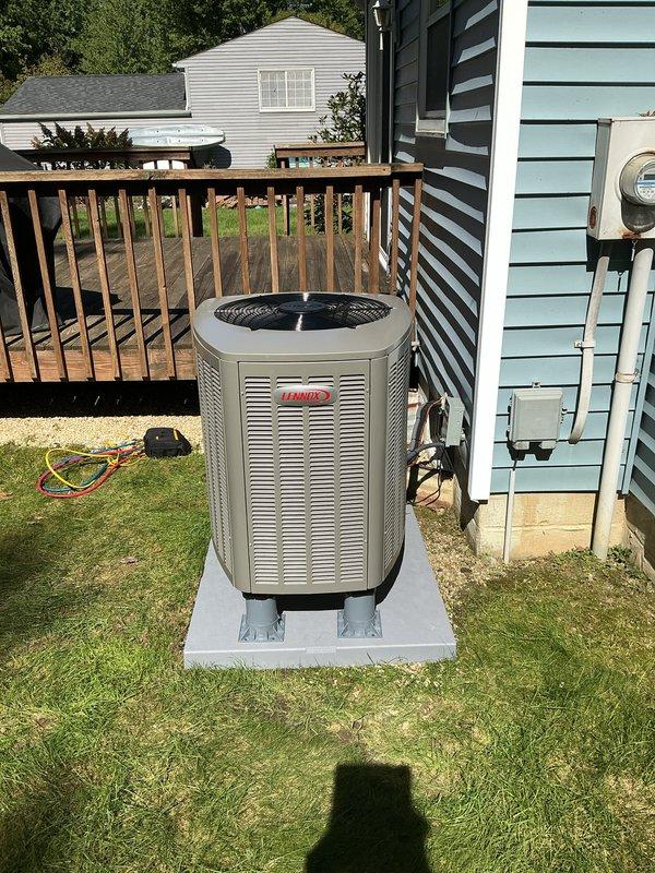 Completed full HVAC system installation including Lennox outdoor condensing unit positioned on concrete pad with proper mounting and refrigerant line connections. Installed air handler with heat pump and auxiliary heat strips, replaced deteriorated insulation at cabinet base, and established all electrical connections including proper metering. System tested and operational with all components functioning to manufacturer specifications.
